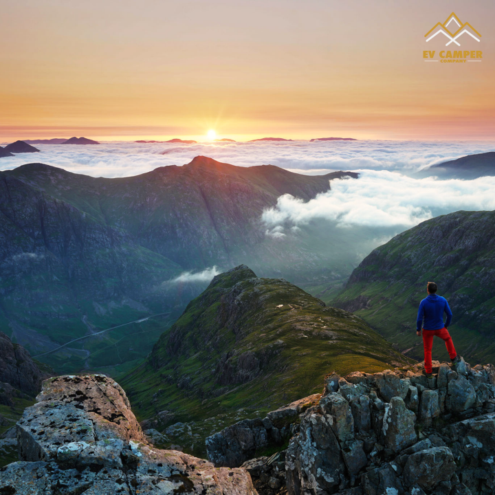 Man on top a mountain in Glencoe.